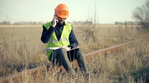 Foreman Designer On Construction Site. Civil Engineer Developer With Helmet. Railroad Building.