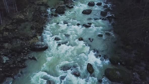 Dangerous looking river in a dark environment with haze.