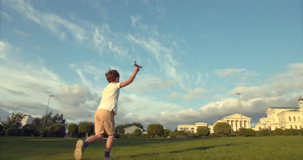 The Boy Plays with a Model Airplane