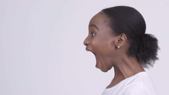 Closeup Profile View of Young Beautiful African Woman Shouting and Screaming