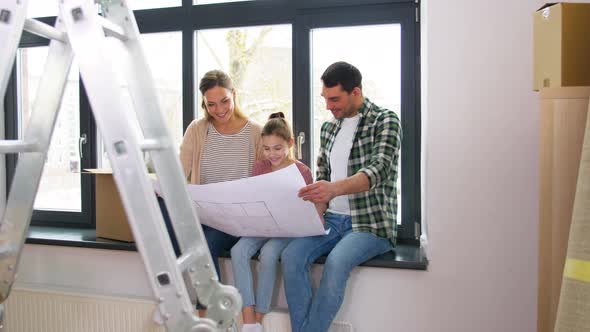 Happy Family with Blueprint Moving To New Home