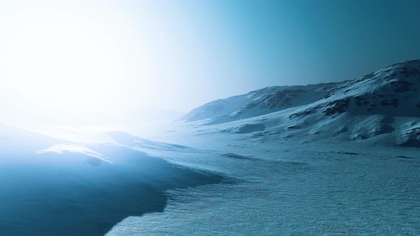 Snowed Mountains in Alaska with Fog