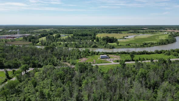 Barn near river and golf course, aerial countryside of Niagara region