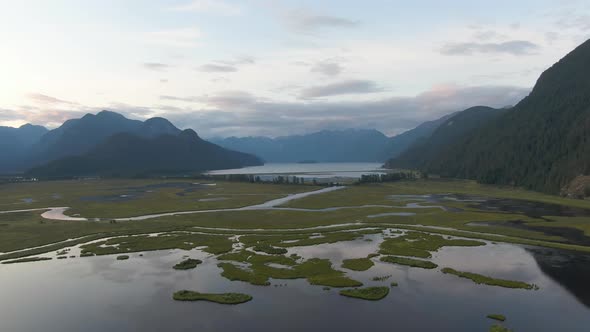 Beautiful Aerial Panoramic View of Canadian Mountain Landscape during a vibrant summer sunset. Taken