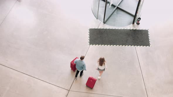 Tourist arriving in airport terminal with lugage