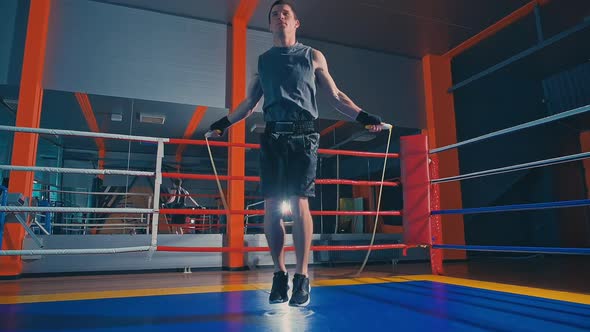 Man Fighter Skipping at the Boxing Ring