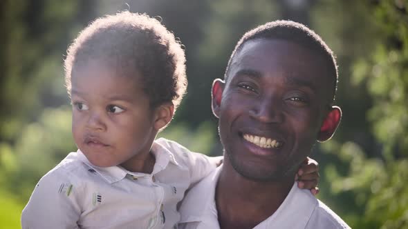 Portrait of an African Man with His Son