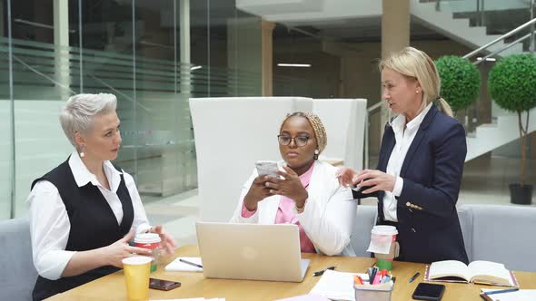 Group of Interracial Business Women Listening To Adult Female Boss Successful Cooperation of