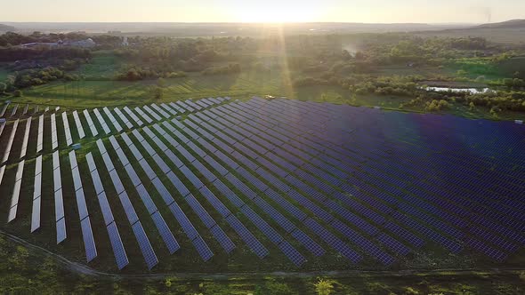 Ecology solar power station panels in the fields green energy at sunset