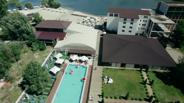 Aerial Video of a Swimming Pool Near the River