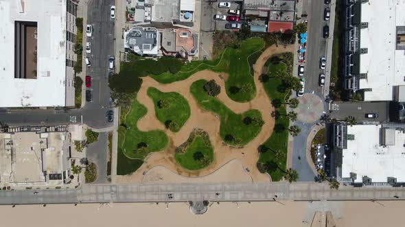 Aerial view above the Noble Park, in sunny Hermosa, Los Angeles, USA - top down, drone shot