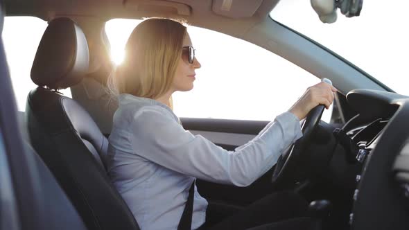 Happy Woman Driving Car