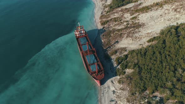 Red Cargo Ship In Blue Sea Water