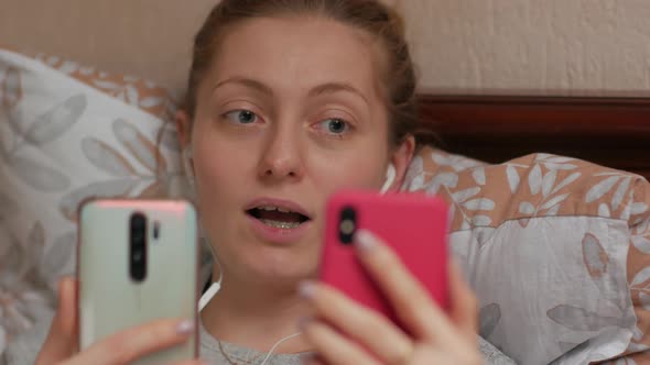 Woman Calling With Two Smartphones