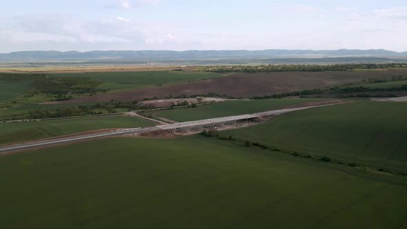 Drone flight over beautiful nature and a newly built highway