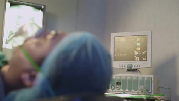 Asian patient on operating theater waiting for operation by group of surgeon doctor and medic team.