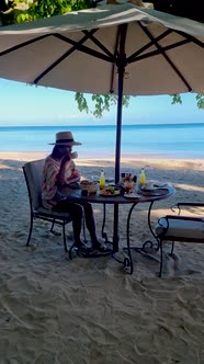 Breakfast on the Beach in Thailand a Luxury Breakfast Table with Food and Beautiful Tropical Sea