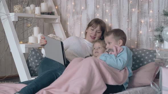 Mom Takes Care of Daughter Gets Help From Son with Tablet