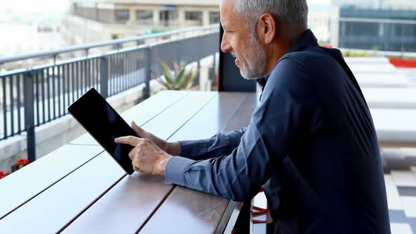 Businessman using digital tablet in hotel