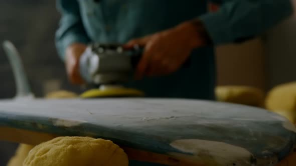 Man grinding surfboard