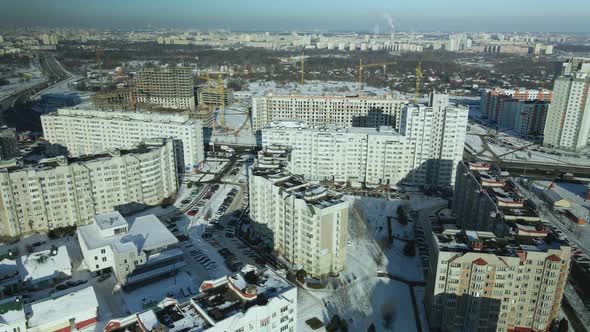 City quarters. Multi-story houses. Winter cityscape.