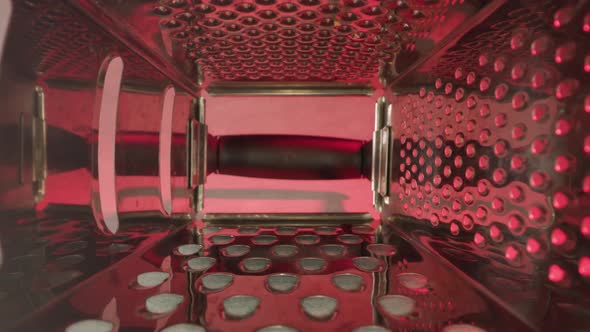 Inside of Grater with Sharp Teeth Under Red Illumination