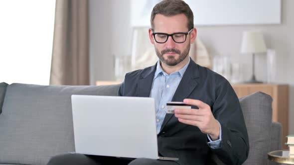 Unsuccessful Online Payment on Laptop By Young Man