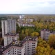 An Approaching Drone Shot of the Concrete Highrise Building in Pripyat - VideoHive Item for Sale