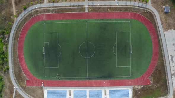 An Open Stadium with Stands for Fans a Football Pitch