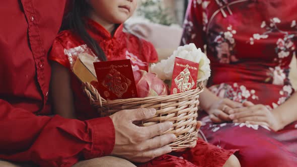 Close Up of Unrecognizable Chinese Family with Gift Basket