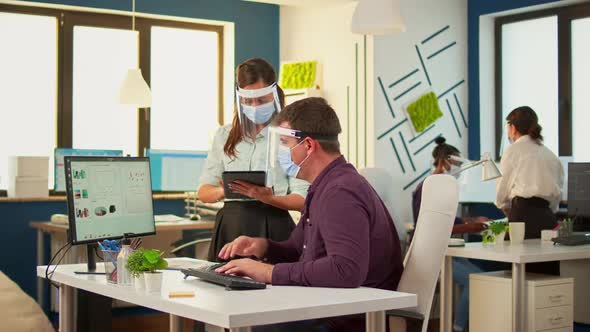 Business People Wearing Protective Masks Making Financial Strategy