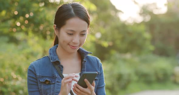 Woman use of mobile phone at outdoor