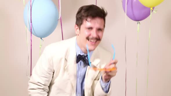 Funny man dancing with props in photo booth