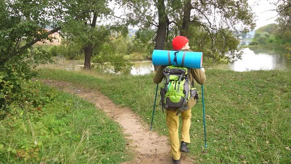 Man with Hiking Equipment Walking in the Place with Amazing Landscape.