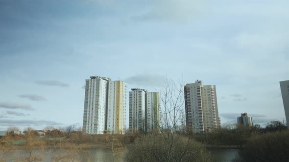 City block near the river. Multi-story houses. Water city system. Aerial photography.