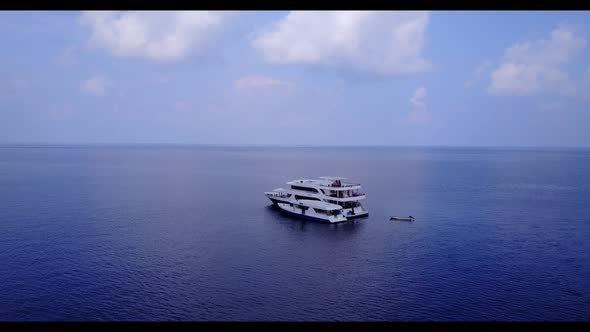 Aerial flying over nature of relaxing bay beach journey by shallow sea and clean sand background of 