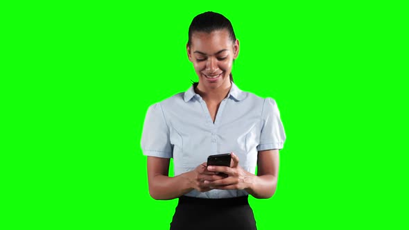 Animation of a mixed race woman in suit using a phone in a green background