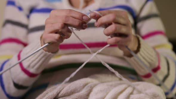 Woman Seamstress Knitting the Sweater Snood