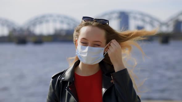 Stylish Blonde Woman Takes Off Surgical Mask and Makes Deep Breath Close View