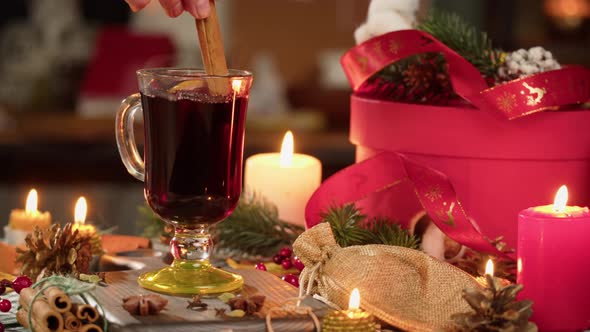 Hot Wine in Glass Mug Gluhwein and Cinnamon Closeup