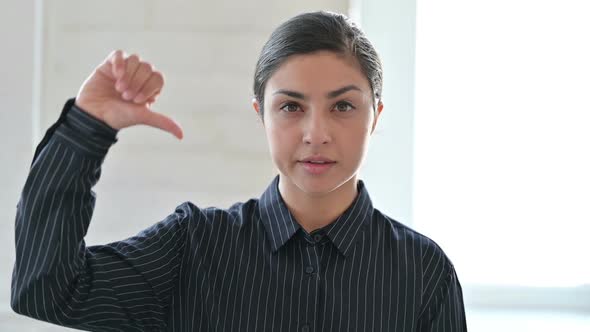 Young Indian Woman Doing Thumbs Down