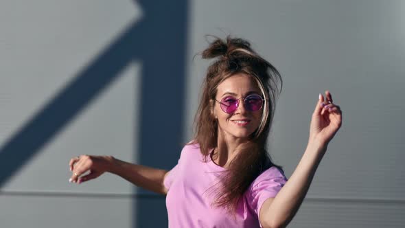 Portrait of Feminine in Pink Summer Outfit Performing Dance