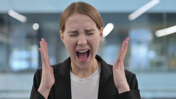 Portrait of Attractive Businesswoman Screaming Shouting