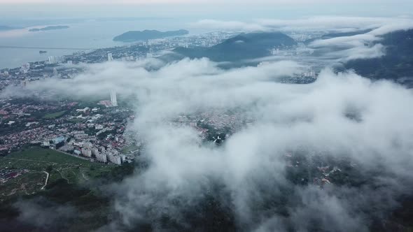 Panning over Paya Terubong with Penang Bridge at back