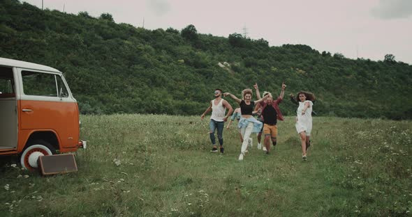 Very Happy Running and Jumping Group of Friends