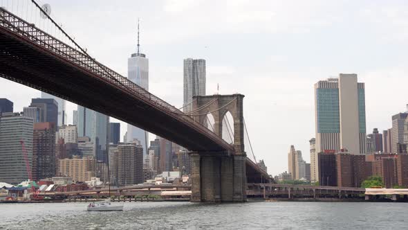 Sailboat Under Brooklyn Bridge