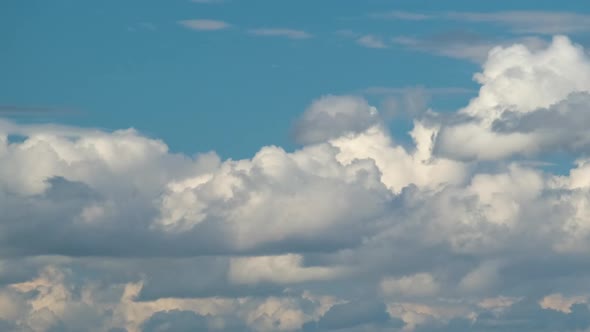 Time Lapse Footage of Fast Moving White Puffy Cumulus Clouds on Blue Clear Sky