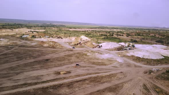 The Truck is Driving Through a Sand Quarry