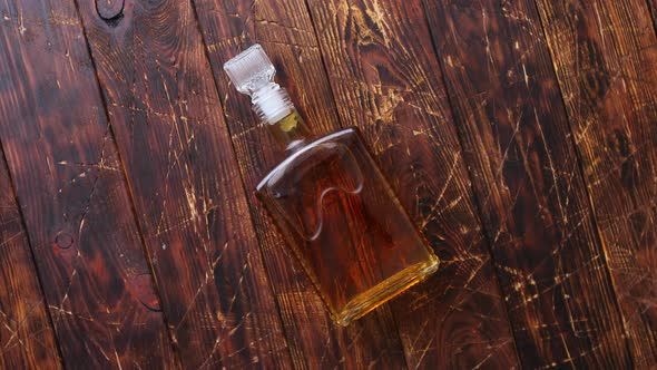 Bottle of Whiskey on Wooden Table