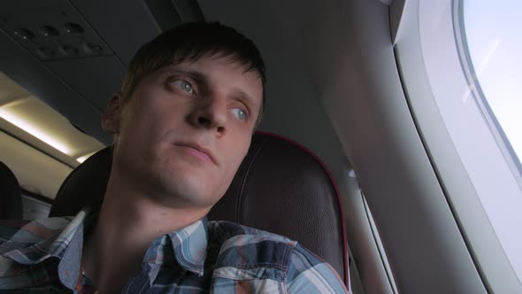 Young Man In Plane Cabin